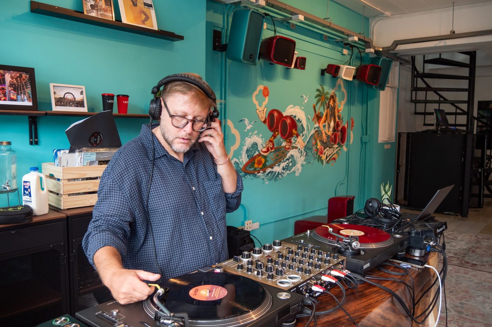 DJ Rudi playing vinyl at the Alba Integrate showroom opening, Phuket