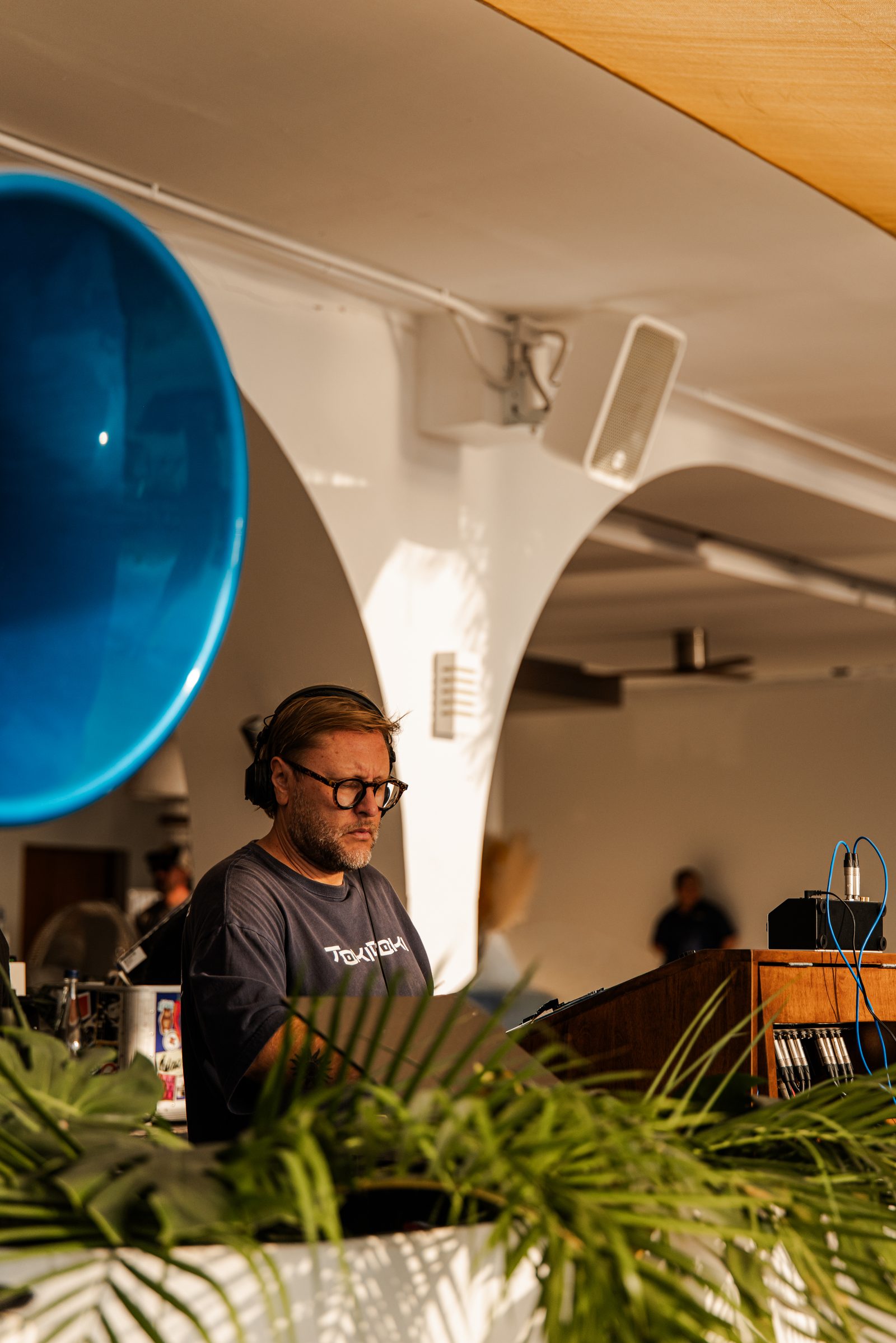 DJ Rudi at the DJ booth during his residency at Fira Beach Club Phuket